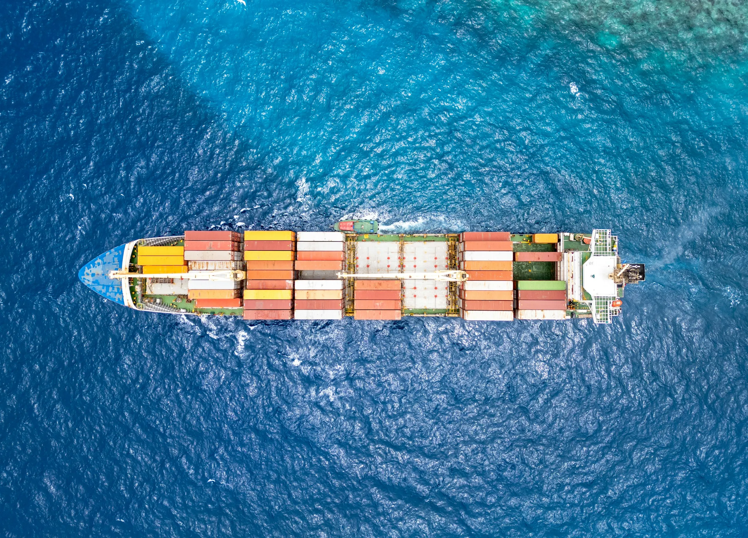 A laden container ship crossing open water
