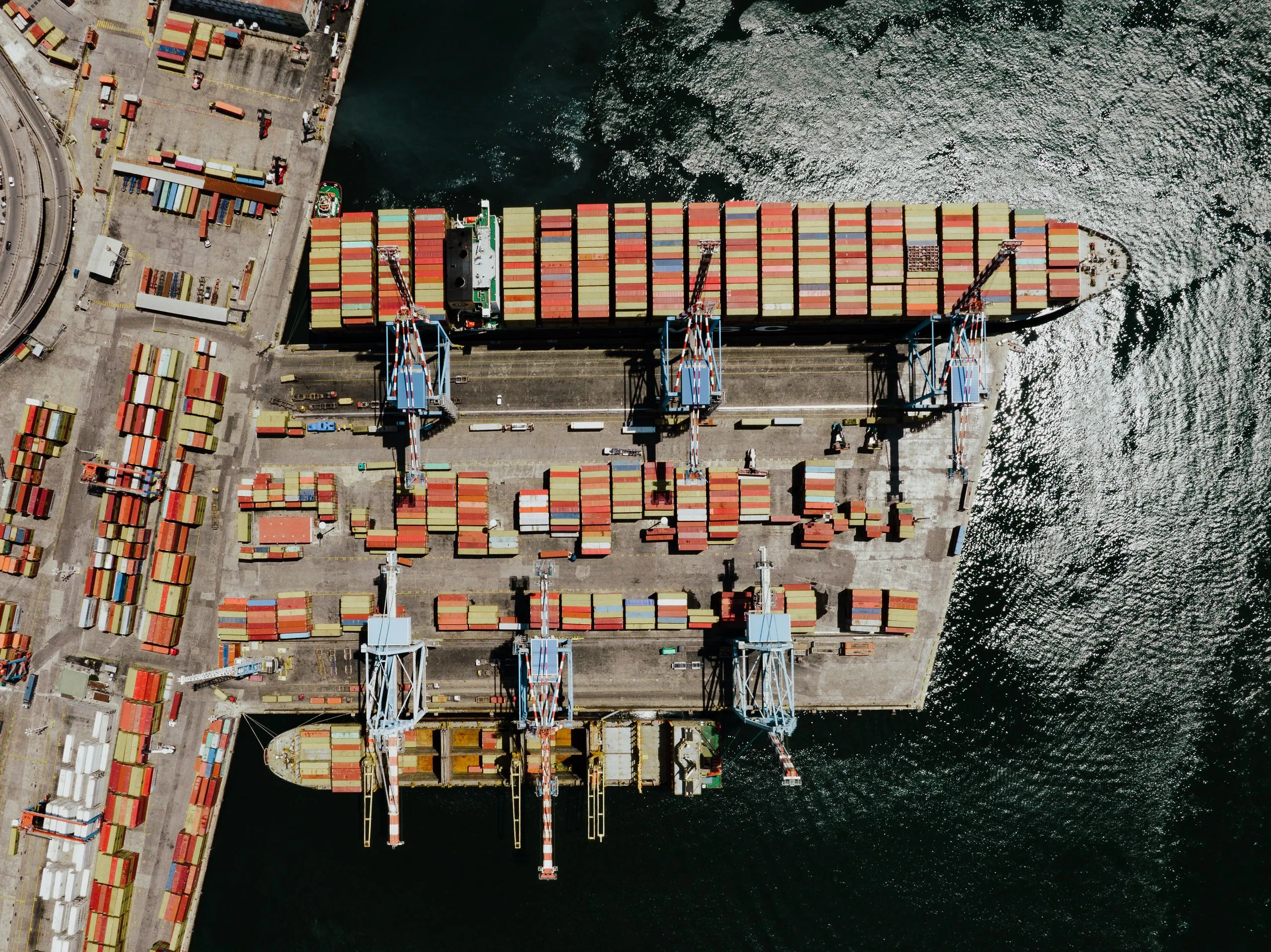 A global container port, goods moving to buyers overseas